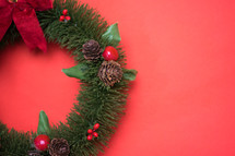 Christmas wreath on red 