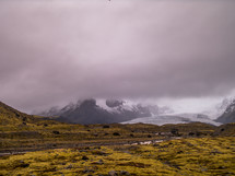 distant mountain peaks under a cloudy sky 