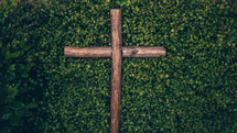 wooden cross in a bush 