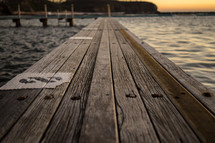 a wood dock over the ocean 