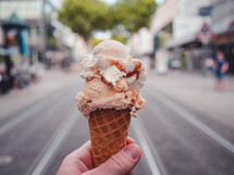 an ice-cream against a city backdrop