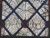 red, blue, and white pattern on a stained glass window 