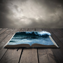 ocean on the pages of an open Bible 