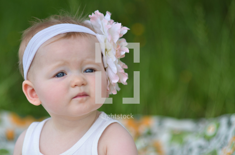 toddler girl with a flower headband