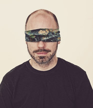 A blindfolded man. 