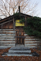 Old cabin with neon sign