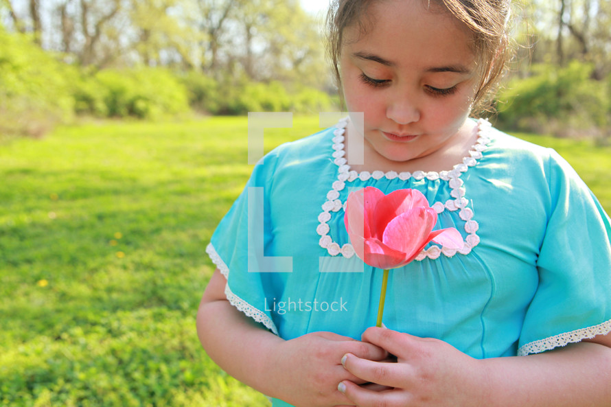 Girl holding a flower
