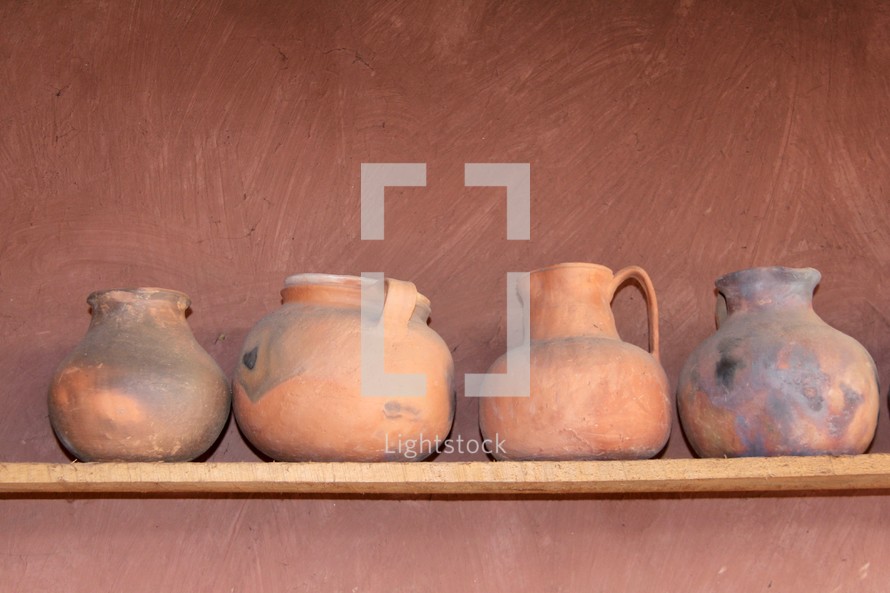 clay pottery on a shelf 