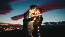 Lovely Couple At Sunset With Fairy Light