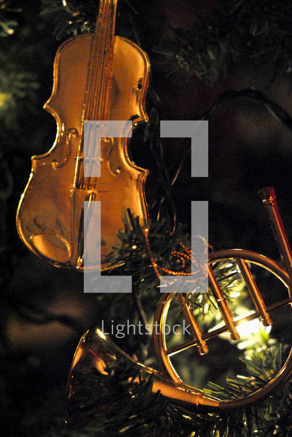 Christmas tree ornaments; violin and French horn.