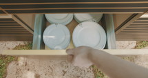 Opening of dishes drawers in an outdoor kitchen