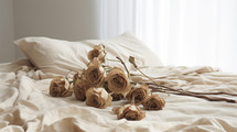Dying roses on a bed. Fading romance concept. 