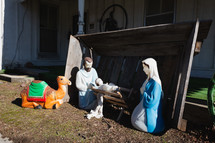 Plastic nativity scene with camel, Jesus, Mary, and Joseph