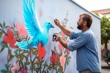 A street artist painting graffiti on a wall, depicting a dove of peace, showcasing artistry and a message of harmony
