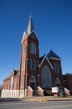 Red brick church with Christmas decorations in small town 