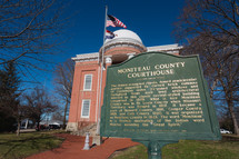 Moniteau County Courthouse building with flags