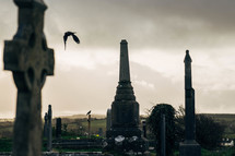 Old Cemetery in Ireland with Celtic Cross Gravestones and Dark Clouds