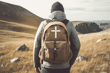 Missionary work A man with a backpack and a cross on a mountain