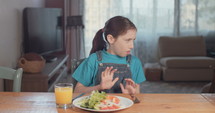 Girl refusing to eat healthy food.