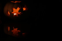 candle in a pumpkin