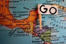 Go flag over Honduras on a globe 