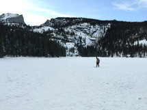 a man walking in deep snow 