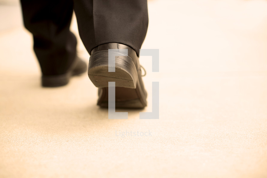 business man walking with purpose 