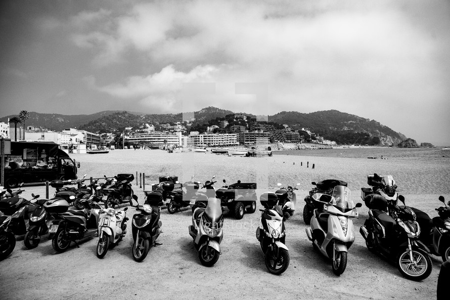 vespas parked by a beach in Spain 