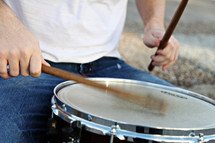 A drummer playing a drum.