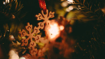 wooden snowflake ornaments on a Christmas tree
