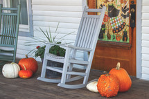 Halloween or trick or treat stock photo background featuring pumpkins on a front porch in October