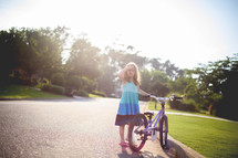 a girl child with a bike 