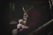 teddy bears in a carseat 