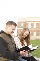 students reading on campus 
