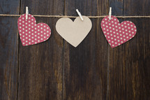 paper hearts hanging on twine for Valentines day 