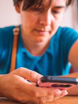 a person scrolling through a smartphone 