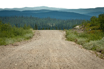 A gravel road up in the mountains