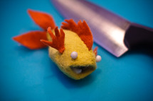 felt toy fish and knife