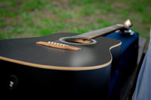 acoustic guitar on a guitar case 