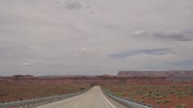 Driving to Monument Valley, Towering Sandstone Buttes on Navajo Tribal on Arizona - Utah Border USA
