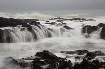 water flowing over rocks on a shore in Oregon 