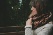 a woman in an animal print scarf 