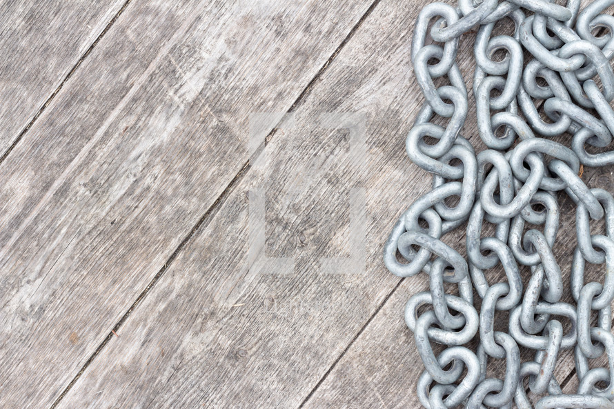 chain links on a wood background 