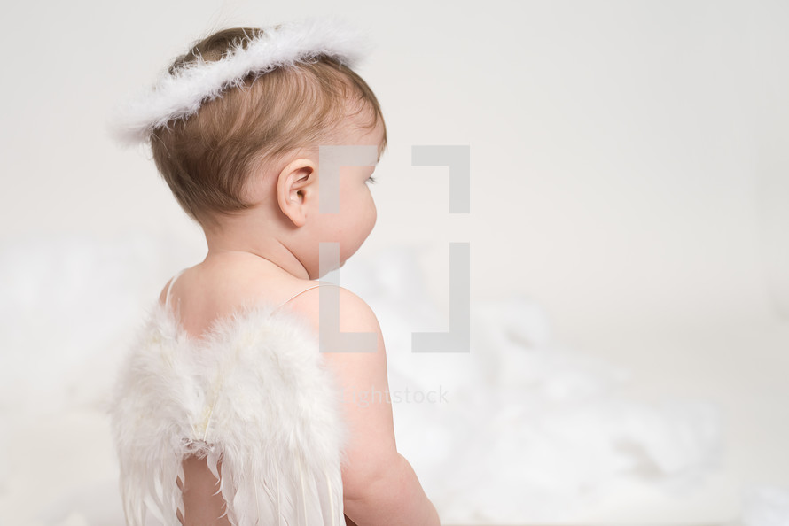 a infant in angel wings 