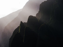 sunbeams on rugged cliffs on a mountainous island landscape 