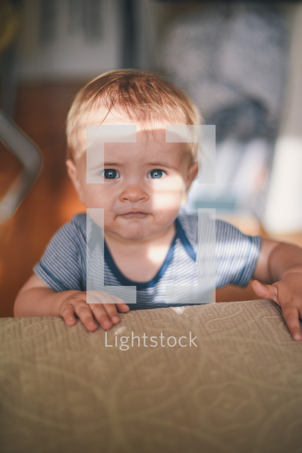 infant looking at the camera 