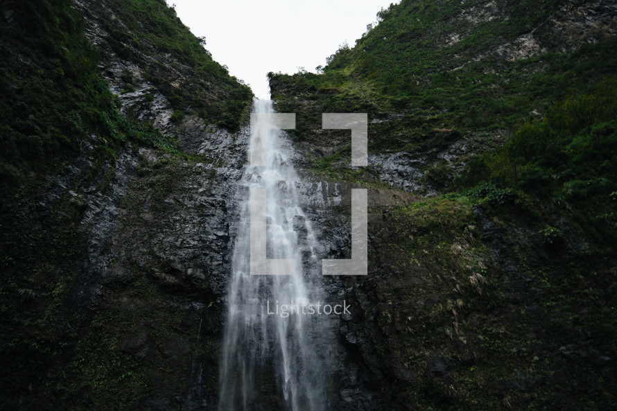 waterfall over the side of a cliff 