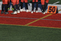 Football players on the sideline