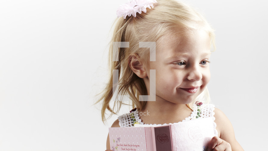 Young girl holding a book