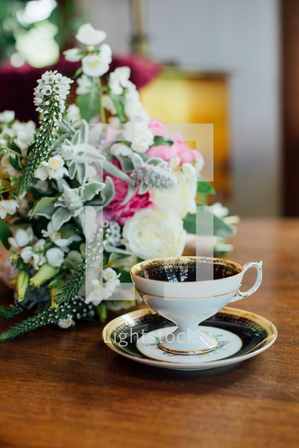tea cup and flower arrangement 